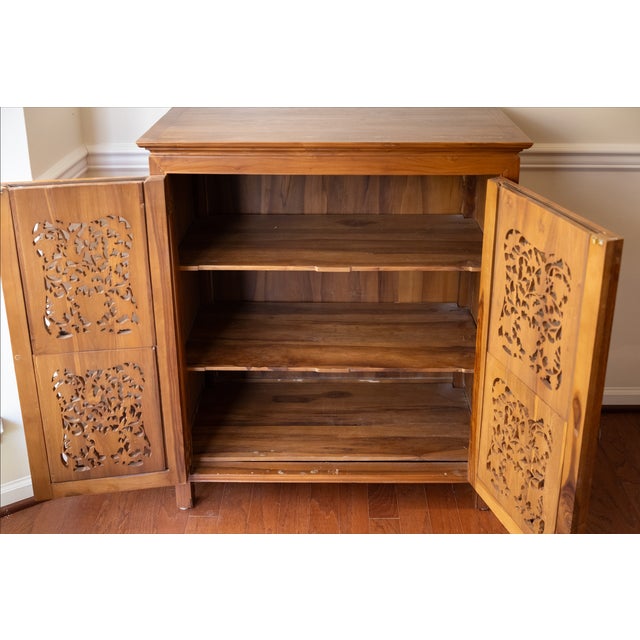 This is a truly amazing and uniquely beautiful custom-designed teak cabinet. This piece is solid, Indonesian teak in...