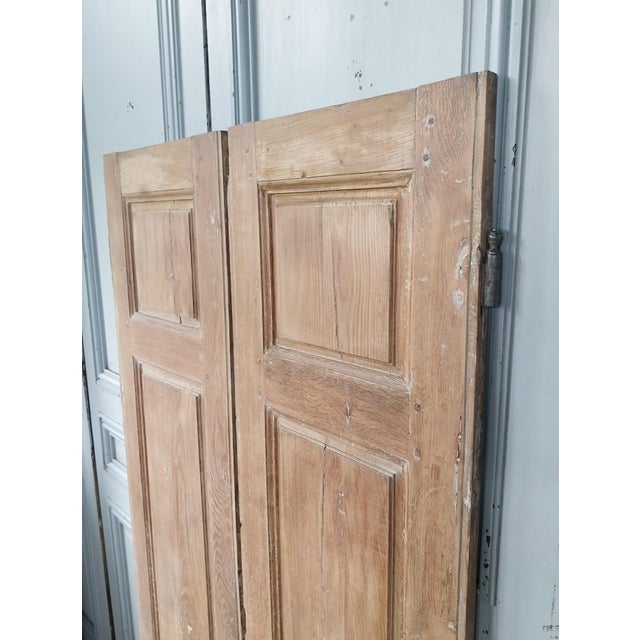 A magnificent pair of antique shutters with authentic charm, marked by time and full of character. They can be used in a...