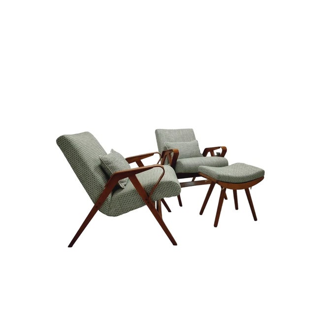 A set of two iconic Mid Century modern armchairs produced by Tatra in the 1950-60s in Czechoslovakia. The solid ash wood...