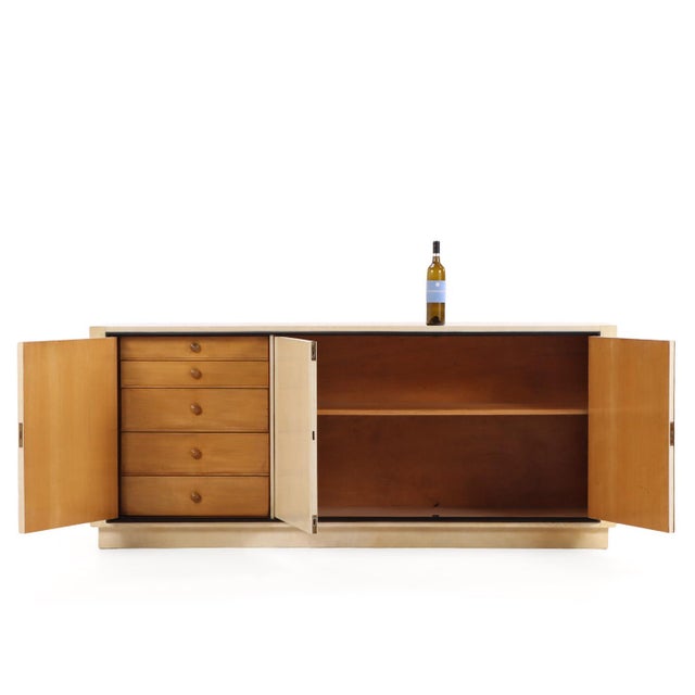This sideboard is one of a pair that we have received in. The refined ebonized trim framing the parchment adds a touch of...