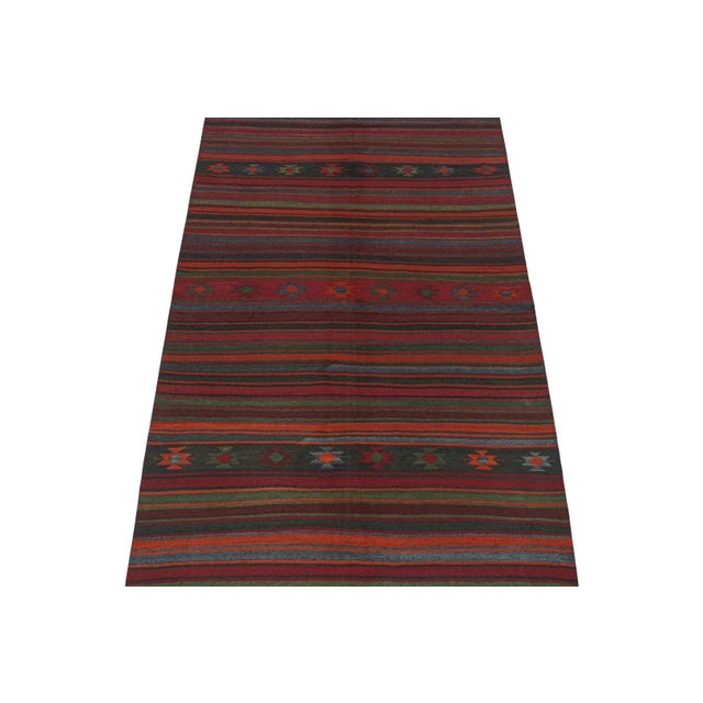 This vintage 5'2''x5'1'' Persian Kilim is a tribal rug of Varamin provenance. Handwoven in wool, it originates circa...