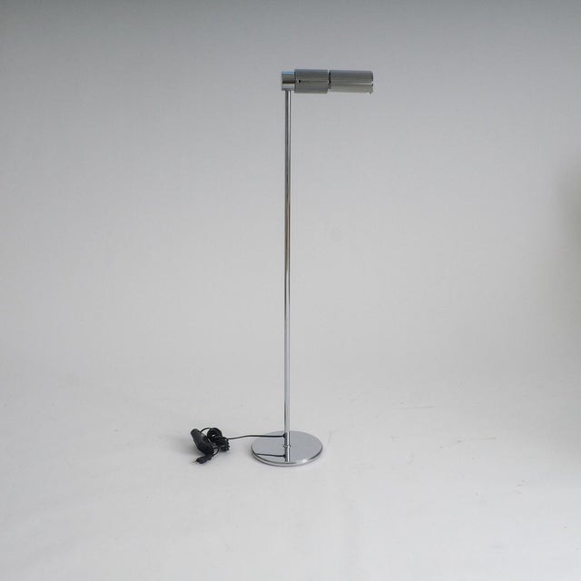 The haloprofil 878hr floor lamp in silver. Bring a piece of swiss precision and 1970s architectural flair into your space...