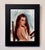This oil on board painting presents a young woman looking over her shoulder, her expression a blend of contemplation and...
