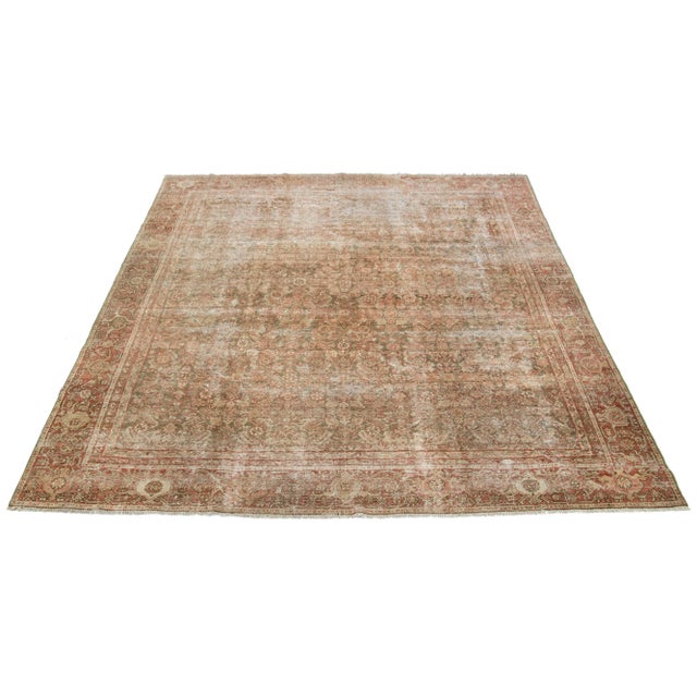 Handcrafted, this Persian Tabriz wool rug beautifully displays a traditional floral pattern. The stunning contrast between...
