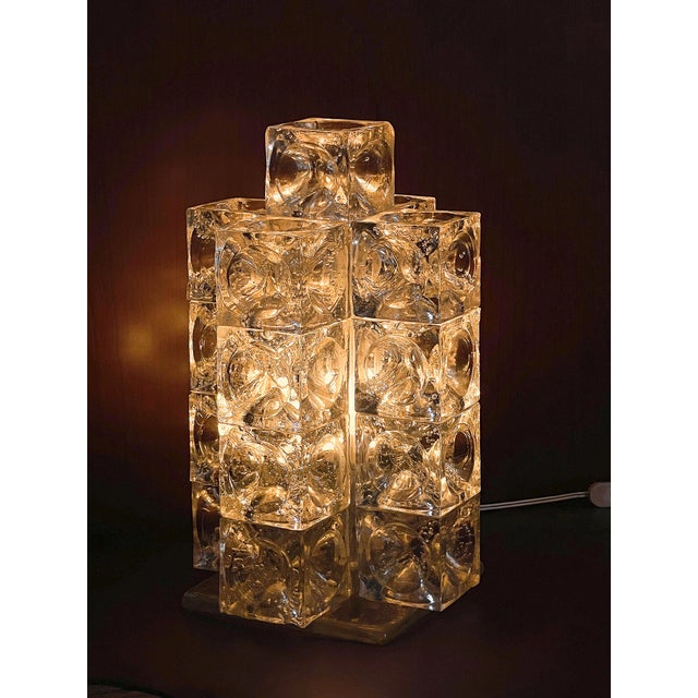 A rare sculptural table lamp designed by Albano Poli for Poliarte in the 1960s. This exceptional piece comprises 17 cubes...