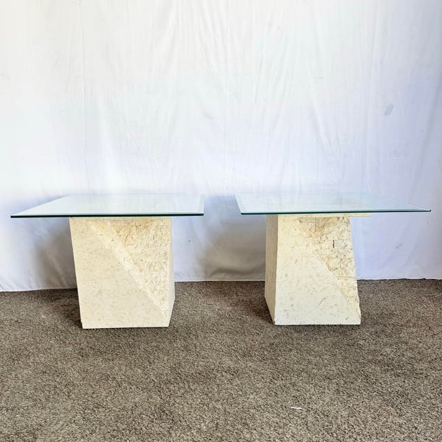 A striking pair of postmodern side tables featuring sculptural bases crafted from tessellated stone in geometric forms...