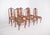 Set of six dining chairs. With cut-out and hollowed-out backrests, it features a double medallion joined by geometric...