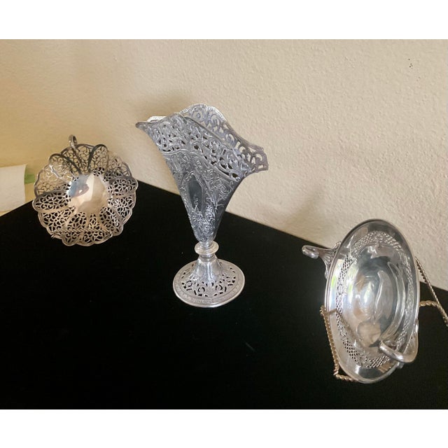 This set of silverplated Art Nouveau decor go well together or separately. The vase stands at 9.5" and 8" width. The...