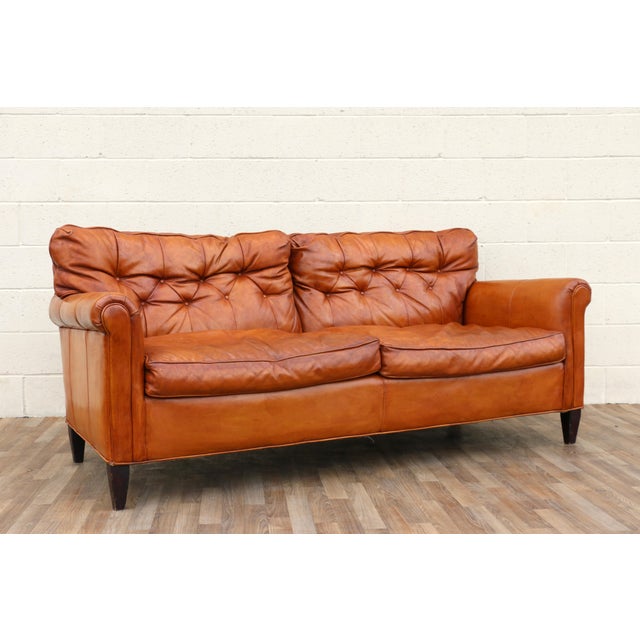 Wonderful vintage American-made leather sofa from the 1970s. Upholstered in a rich honey brown leather that has developed...