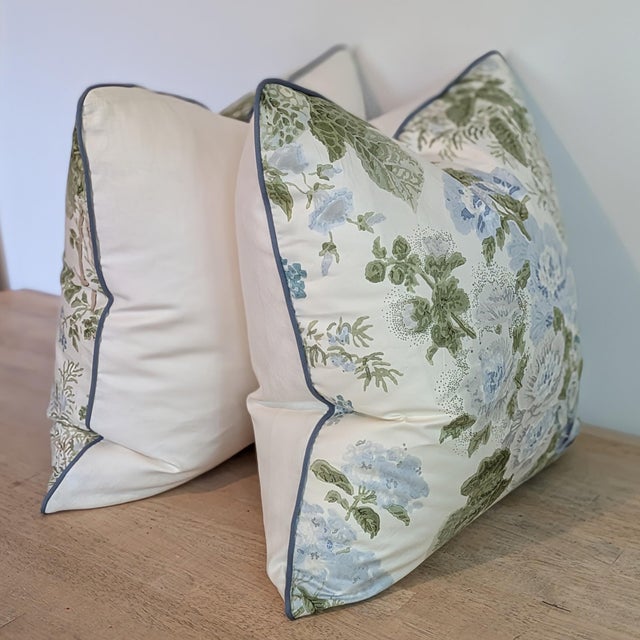Lee Jofa Hollyhock cotton chintz in blue/leaf colorway. A classic Lee Jofa design, this cotton chintz is a hand block...