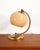 Adjustable brass table lamp with opal glass diffuser. Made by Fratelli Martini (FM), Italy, 1940s. Model "203" table lamp...