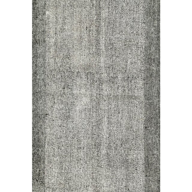 A vintage Turkish flat-woven Kilim rug from the late 20th century. Measures: 9' 5" x 12' 11"