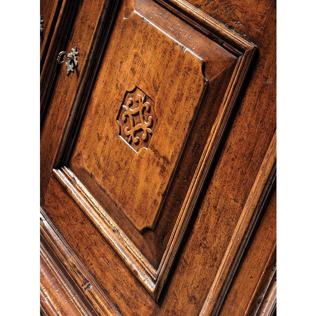 Handcrafted in Italy from solid walnut, this sideboard features raised panel doors and an antique distressed finish that...