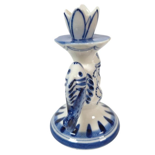 This is a vintage Russian Gzhel porcelain double-fish candlestick with a tulip-shaped cup and hand-painted cobalt-blue...