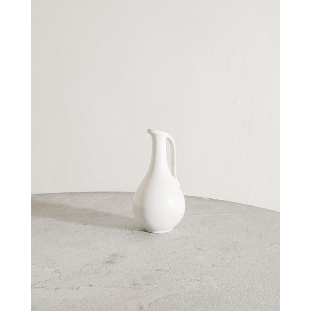 White decorative Swedish mid century ceramic pitcher by Gunnar Nylund for Rörstrand, Sweden 1950s In good original...