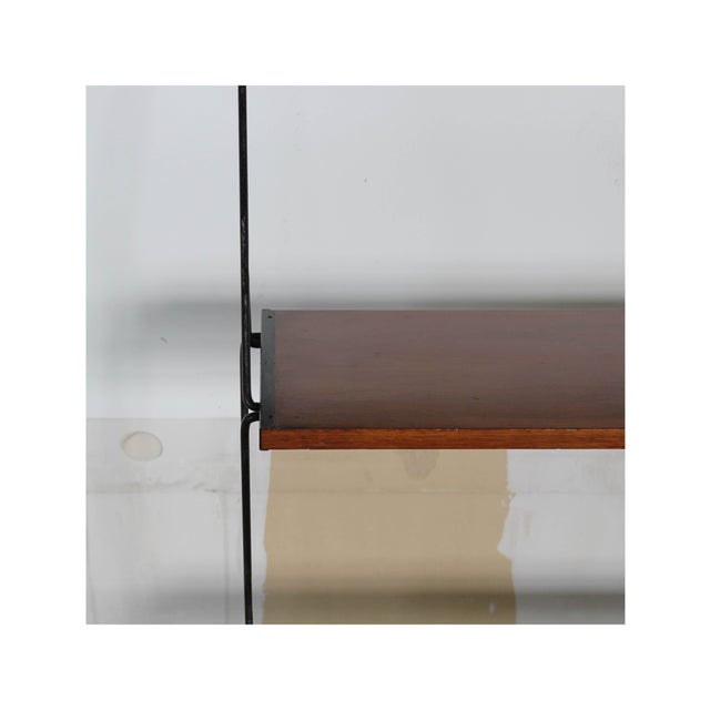 Suspended bookcase Date 1960-69 Origin Italy Materials Teak, Iron Model Bookcase with three shelves Condition Preserved