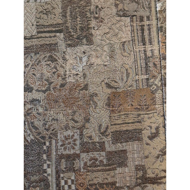 A Japanese Kesa (Monk's Vestment) made from thirteen columns of patchworks of brocades set within a border of the same...