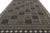 This oversized 10x14 Scandinavian kilim showcases a repeating geometric pattern in gray, blue, taupe, and ivory tones....