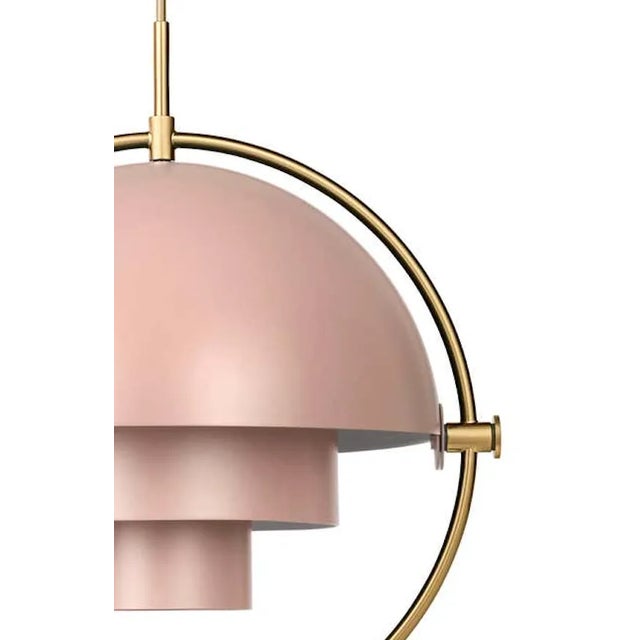 Louis Weisdorf 'Multi-Lite' pendant lamp in rose and brass. Designed in 1972 by Weisdorf, this is an authorized re-edition...