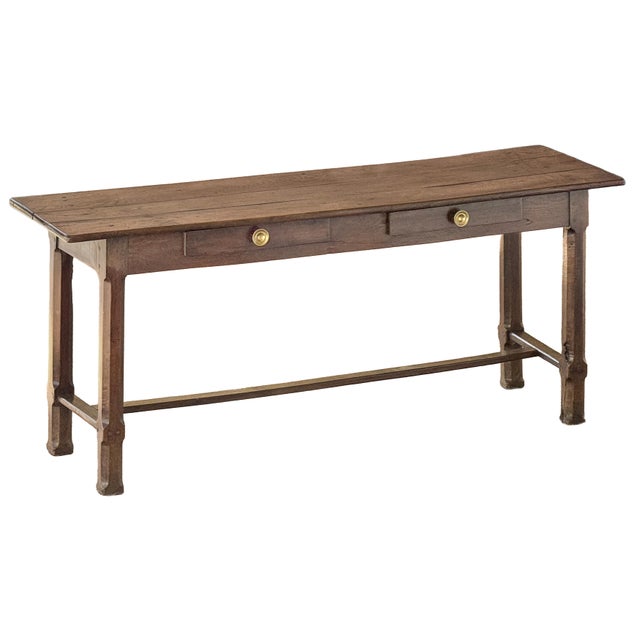 A fine French rustic hall table or console server of patinated oak, from the 19th century, featuring a rectangular plank...