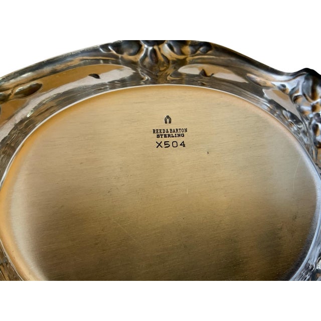 The Reed & Barton mark "X504" refers to a specific pattern of their sterling silver hollowware, often found on bon bon...