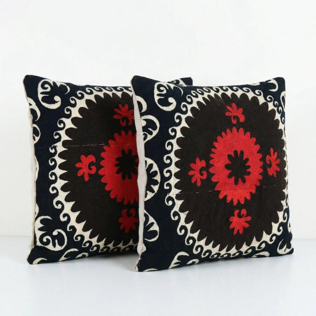 This beautiful 24'' x 24'' hand-embroidered Suzani pillow cover set was made from authentic Uzbek cotton fabric. The...