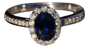 The Capella: Sapphire and Diamond Halo Ring in 14 Karat White Gold