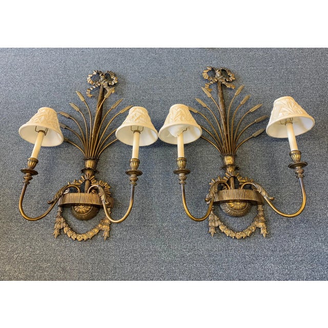 A wonderful pair of large Hollywood Regency style wall sconces from the mid 20th century by La Barge. They are made of...
