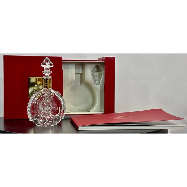 A rare, elegant and highly collectible Louis XIII de Rémy Martin crystal miniature decanter, presented in its original...