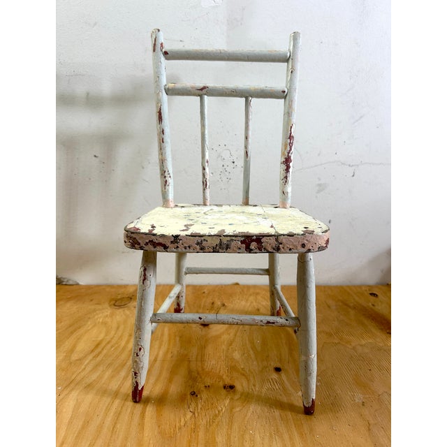 This petite 1890s child’s chair is a beautiful relic of time, perfect for a contemporary modern farmhouse aesthetic....