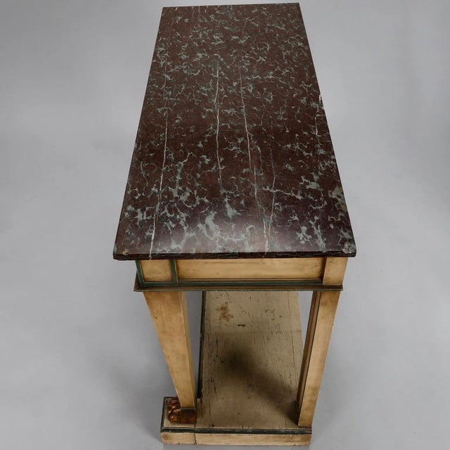 Early 19th century Venetian wood console with carved and gilded lion's paw feet, reeded supports and original paint. Circa...