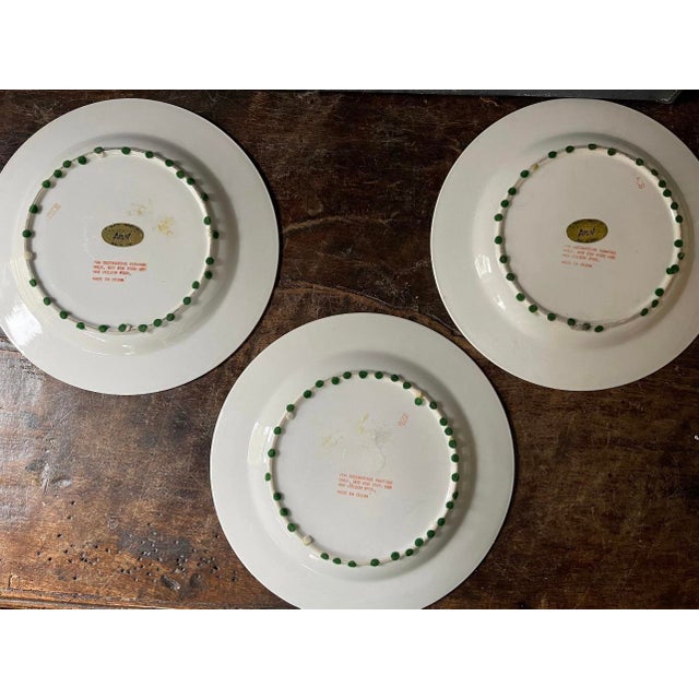 Lovely set of three large plates each depicted in a soft white with a rich royal blue design. Each plate is different with...