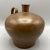 Wonderful craftsmanship in this hand made hammered cramp seamed copper vessel. It has the appearance of a moonshine/water...