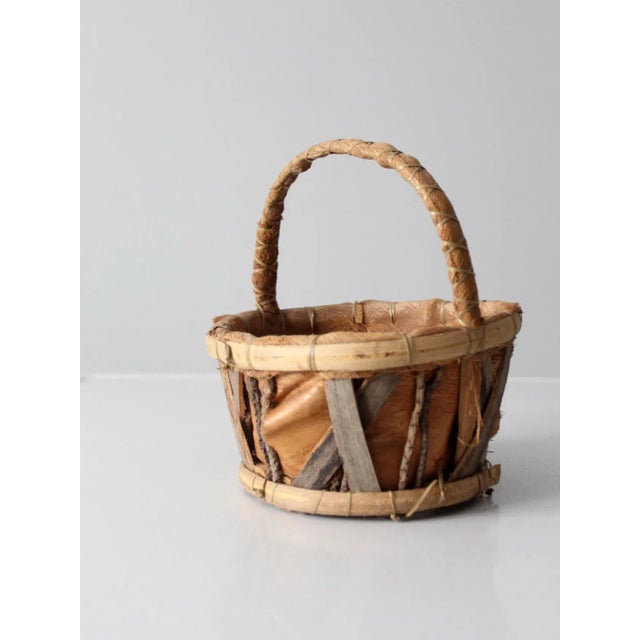 A beautifully crafted vintage woven bark basket that celebrates the warmth and authenticity of natural materials....