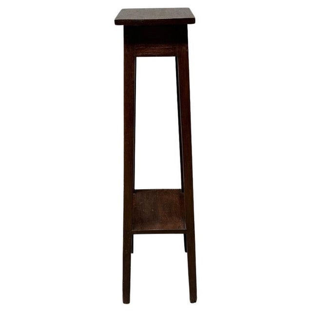 Antique pedestal originally used to hold flowers or plants. Full dimensions ; top shelf 8″ x 8″ x bottom shelf 9.5″ x 9.5″...