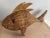 This vintage woven rattan fish is a striking decorative piece with a metal frame for added structure. Measuring...
