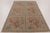 Handmade in wool, this antique hooked rug measures 6x9 and dates to circa 1920-1930. The design features repeating floral...