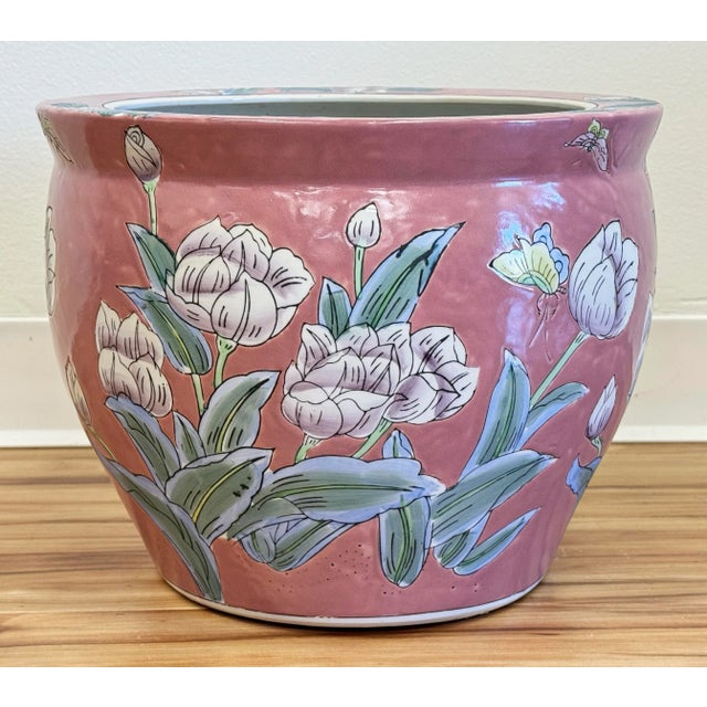 Vintage Chinese porcelain fish bowl planter featuring rich salmon pink background with floral motif throughout. Wonderful...