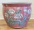 Vintage Chinese porcelain fish bowl planter featuring rich salmon pink background with floral motif throughout. Wonderful...