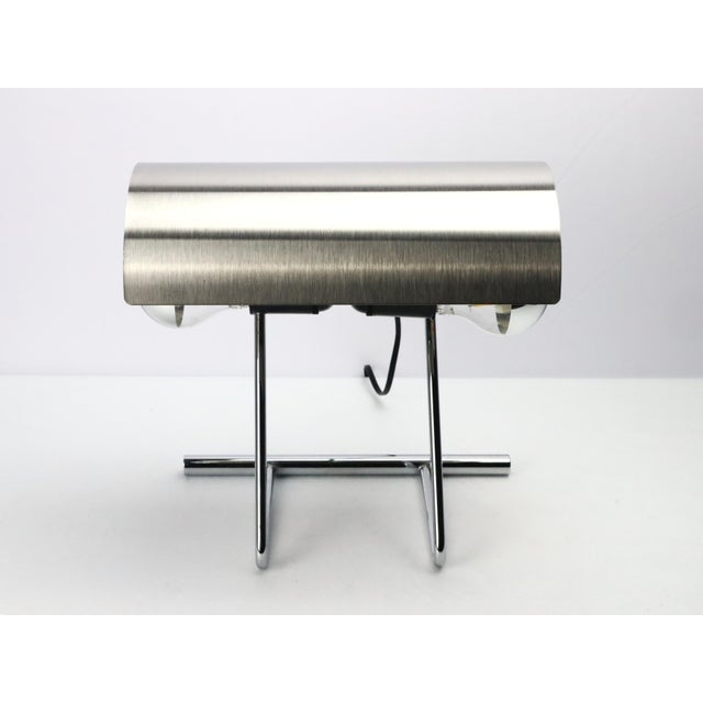 François Monnet style desk lamp, 1970s. Brushed stainless steel reflector. Chromed tubular base and stem. Two light bulbs....