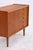 Vintage teak chest of drawers with five spacious drawers and a side cabinet. The round wooden handles, the neatly framed...