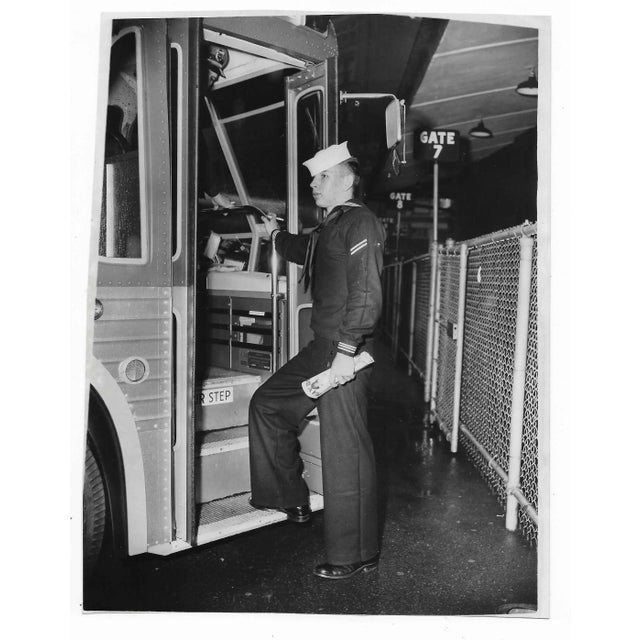 Photo of a sailor getting on the bus in New York headed to Franklin, New Hampshire. Publication information on back.