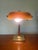 Sophisticated and elegant vintage bankers style lamp with beautiful orange glass shade. This lamp is made out of brass and...