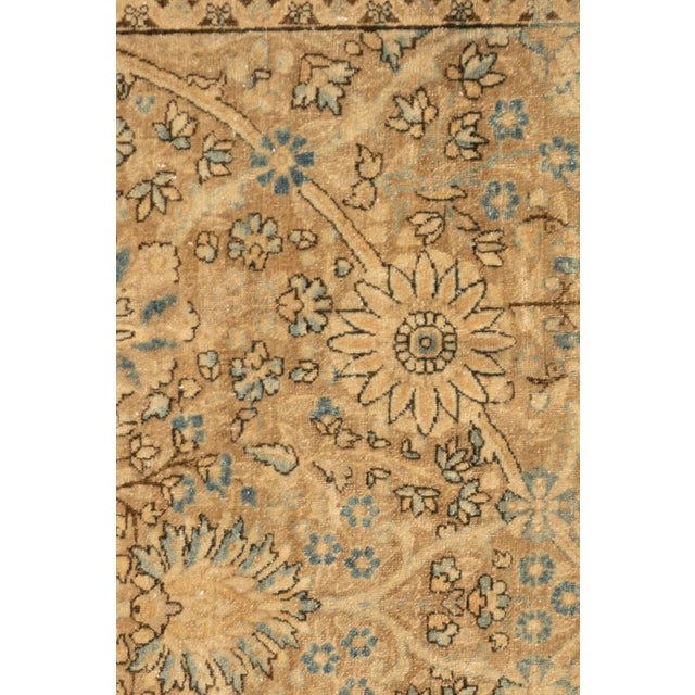 A soft and gentle design on an ivory field which blends in with the border to create this hand knotted rug. Colors:...