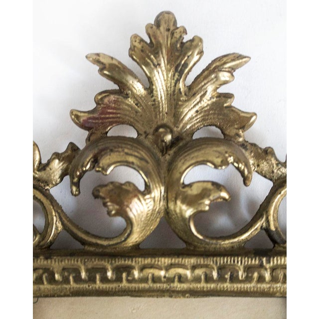 Ornate scrolled metalwork photo frame with patinized/muted gold finish. Original glass included. Measurements: Outside 12"...