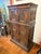 A dramatic centerpiece, steeped in Old World charm and historical narrative. Dark, seasoned wood is hand carved with deep-...