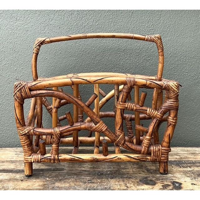 This striking vintage magazine rack is a quintessential example of Boho Chic design, featuring a sculptural, twig-inspired...