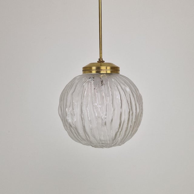 An elegant mid-century modern pendant lamp designed by angelo brotto for the italian manufacturer esperia during the...