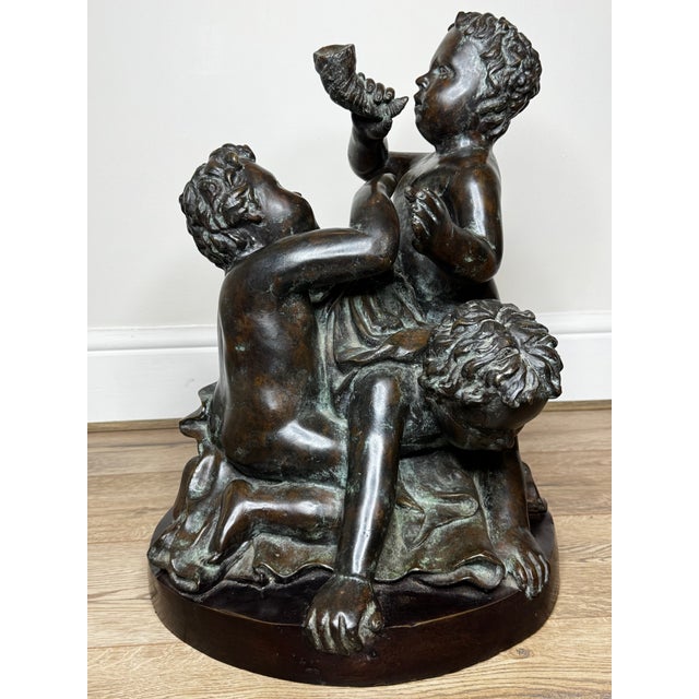 This impressive early 19th-century French bronze depicts a dynamic group of three sea putti, inspired by the work of...