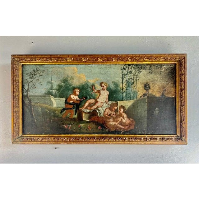 19th C. Original Oil on Canvas depicting a group of cherubs making flower garlands. It is charming and whimsical. The...